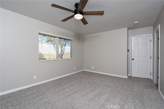 carpeted empty room with ceiling fan