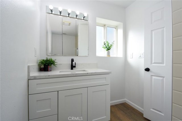 bathroom featuring hardwood / wood-style floors and vanity