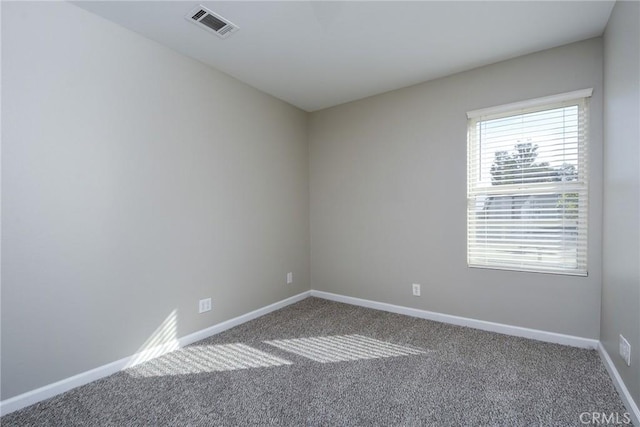 empty room featuring carpet flooring