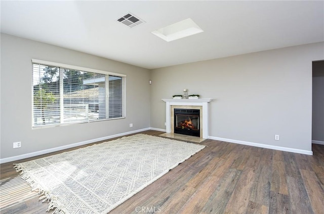 unfurnished living room featuring dark hardwood / wood-style flooring