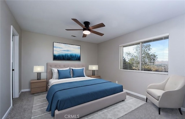 bedroom with ceiling fan and carpet