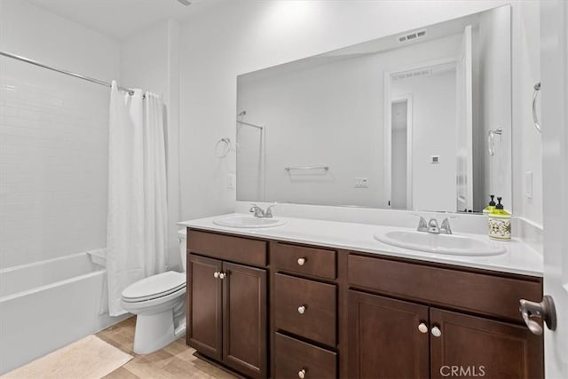 full bathroom with toilet, vanity, and shower / bath combination with curtain