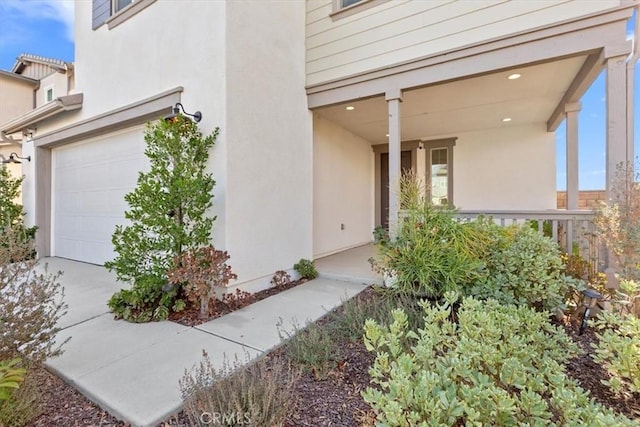 view of exterior entry featuring a garage