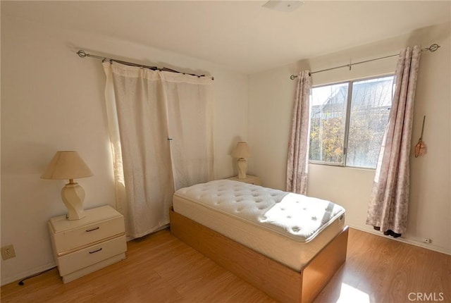 bedroom with light wood-type flooring