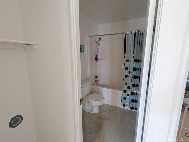 bathroom featuring toilet and shower / bathtub combination with curtain