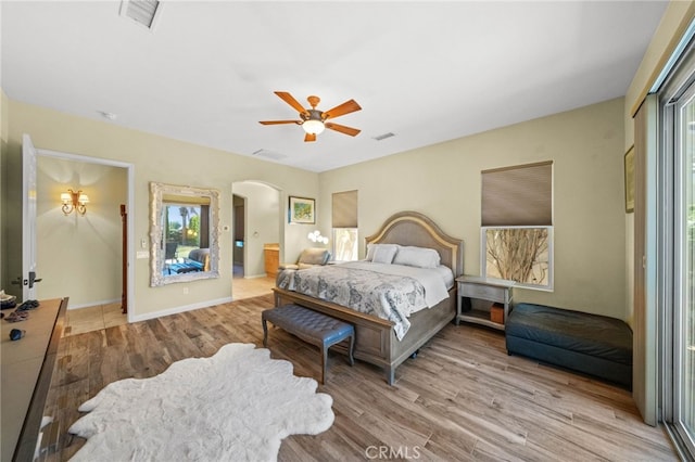 bedroom with ceiling fan and light wood-type flooring