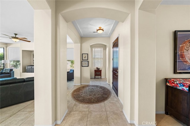 corridor featuring light tile patterned flooring