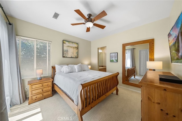 bedroom with light colored carpet and ceiling fan