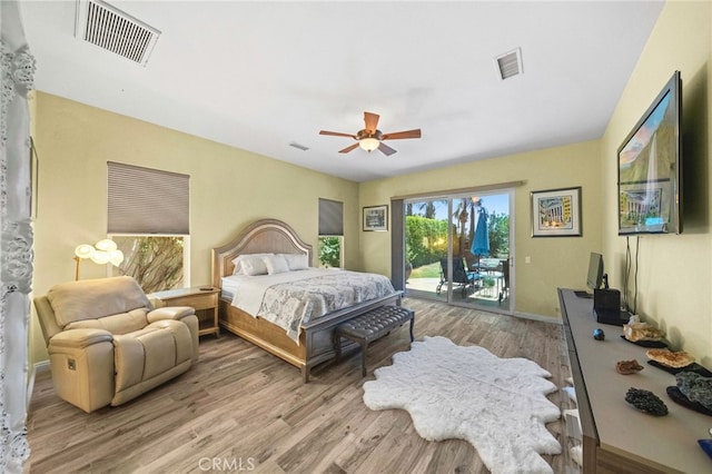 bedroom with ceiling fan, access to exterior, and light hardwood / wood-style floors