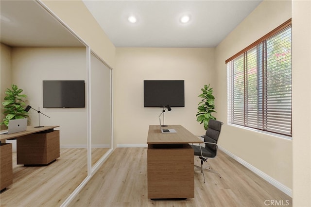 office area with light hardwood / wood-style flooring