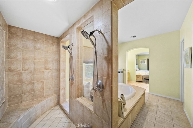 bathroom with plus walk in shower and tile patterned floors