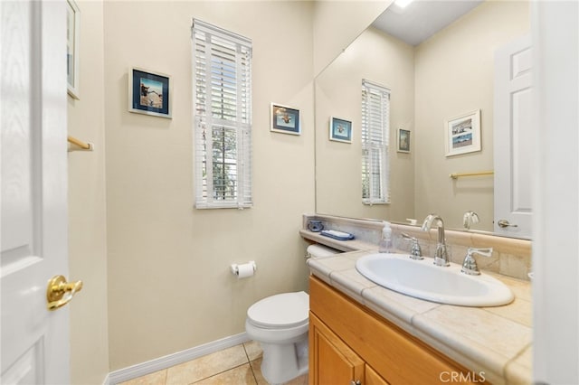 bathroom featuring vanity, tile patterned floors, and toilet