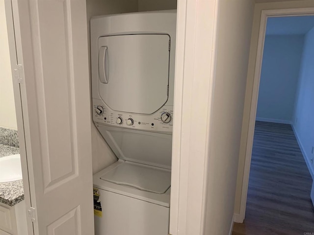 laundry room featuring stacked washing maching and dryer