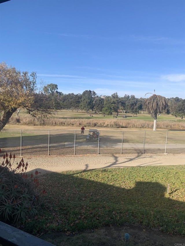 view of yard with a rural view