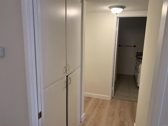 corridor featuring light hardwood / wood-style floors