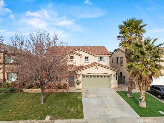 mediterranean / spanish house featuring a front lawn