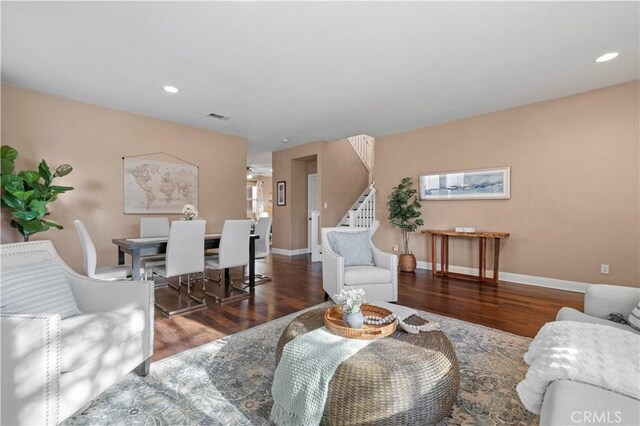 living room featuring dark hardwood / wood-style flooring