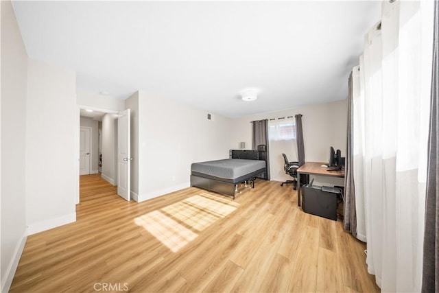 bedroom with light hardwood / wood-style floors