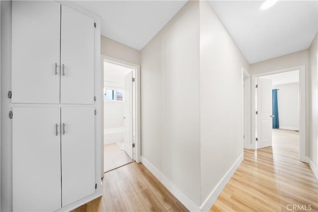 corridor featuring light hardwood / wood-style flooring