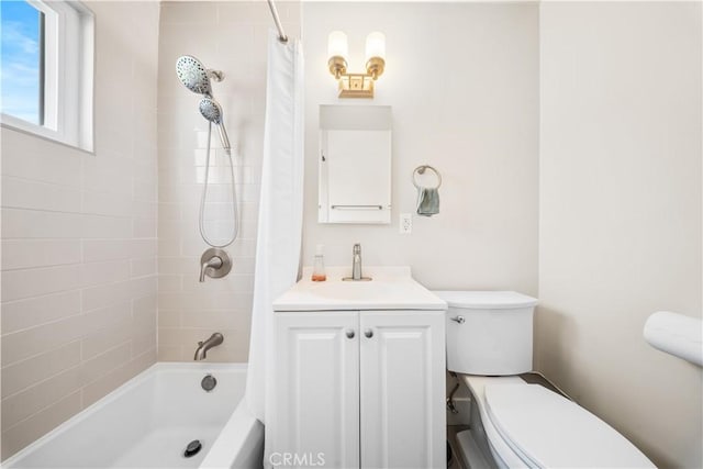 full bathroom featuring toilet, vanity, and shower / bath combination with curtain