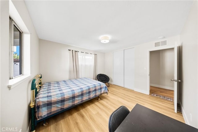 bedroom featuring a closet and hardwood / wood-style flooring