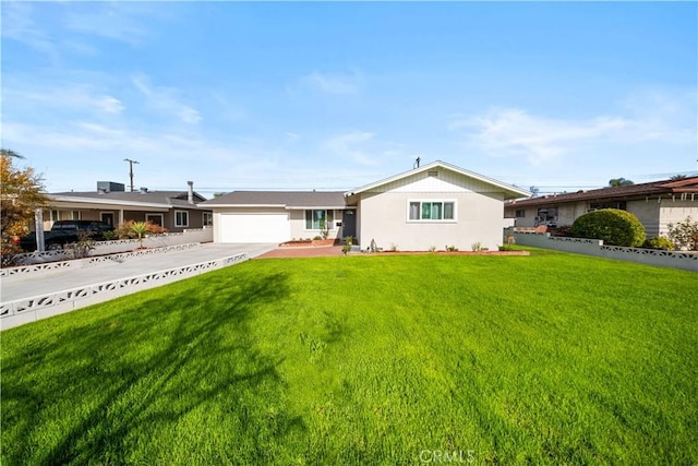 single story home featuring a garage and a front yard