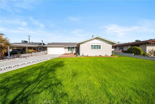 ranch-style home with a front yard and a garage