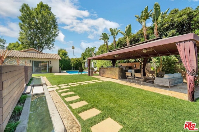 view of yard featuring a patio area and a fenced in pool