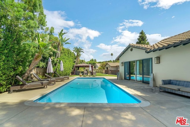 view of swimming pool featuring a patio