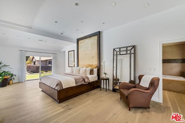 bedroom with access to outside and light wood-type flooring