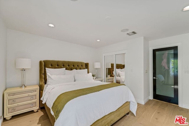 bedroom with light hardwood / wood-style floors