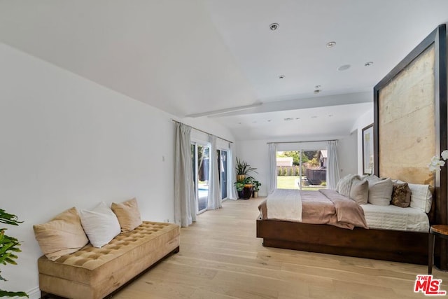 bedroom with lofted ceiling, light wood-type flooring, and access to exterior