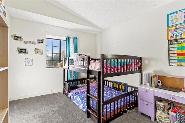 bedroom with a textured ceiling, lofted ceiling, and dark carpet