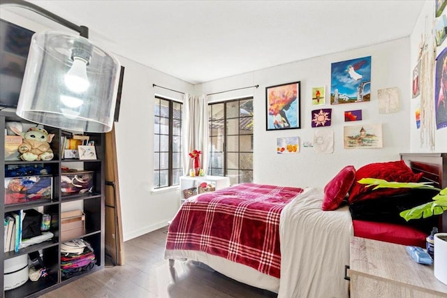 bedroom with wood-type flooring