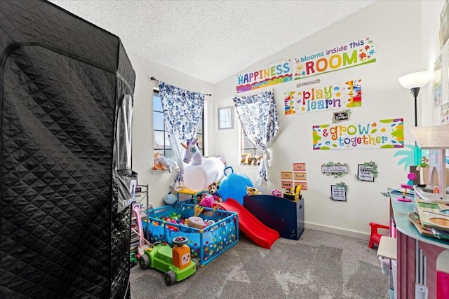 rec room featuring carpet floors, a textured ceiling, and vaulted ceiling