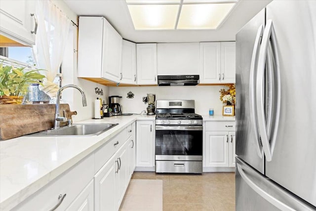 kitchen featuring white cabinetry, stainless steel appliances, sink, ventilation hood, and light tile patterned floors