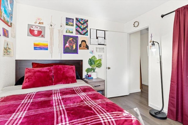 bedroom with hardwood / wood-style floors