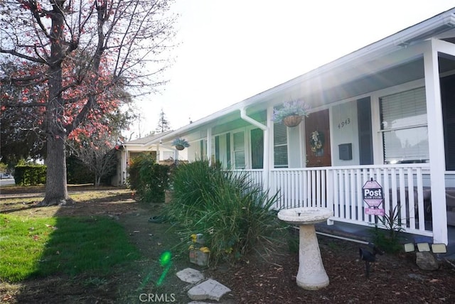 view of home's exterior featuring a porch