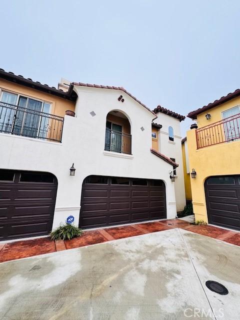 mediterranean / spanish house with a balcony