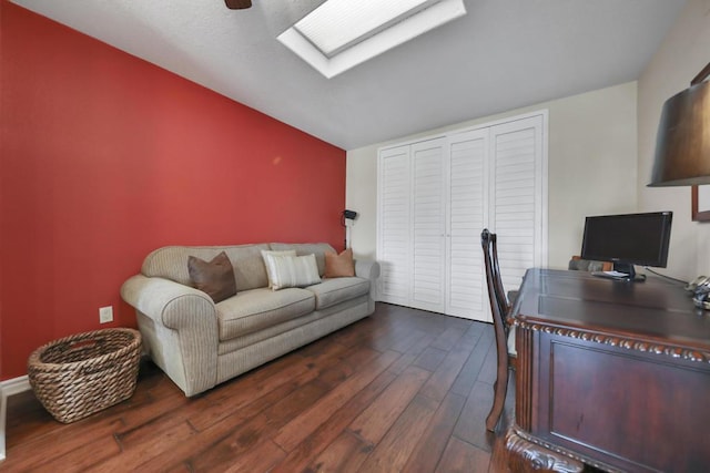 office featuring a skylight and dark hardwood / wood-style flooring