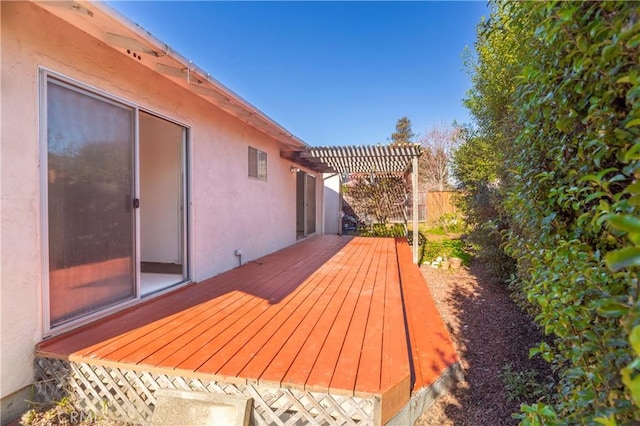 wooden deck with fence and a pergola