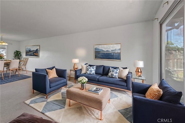 living area with carpet floors and a wealth of natural light