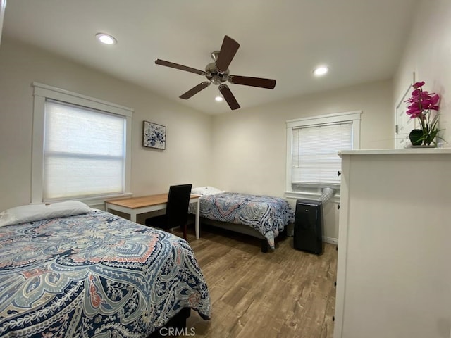 bedroom featuring ceiling fan and light hardwood / wood-style flooring