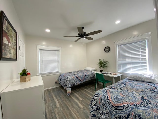 bedroom with ceiling fan and dark hardwood / wood-style flooring