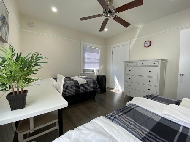 bedroom featuring ceiling fan and dark hardwood / wood-style floors