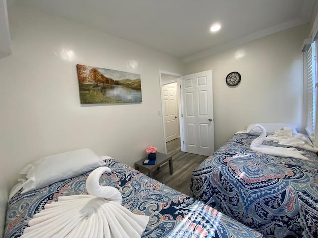 bedroom featuring dark hardwood / wood-style flooring