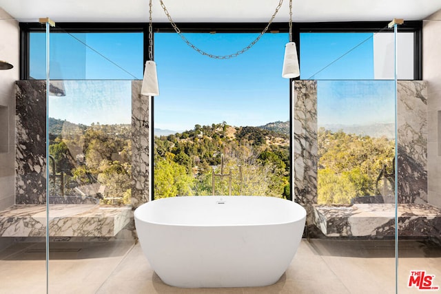 bathroom featuring a bathtub and tile patterned flooring