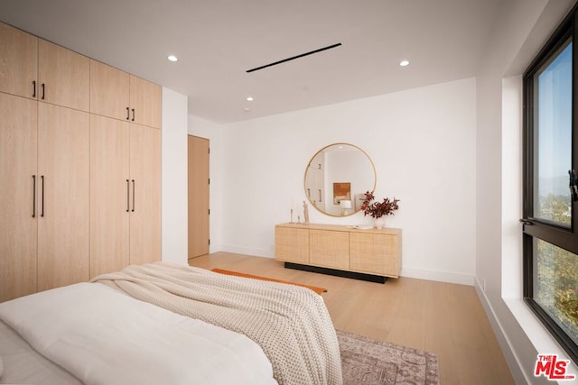 bedroom featuring light wood-type flooring