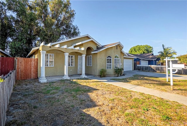 ranch-style house with a front lawn and a garage