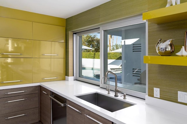 kitchen with sink and dark brown cabinetry